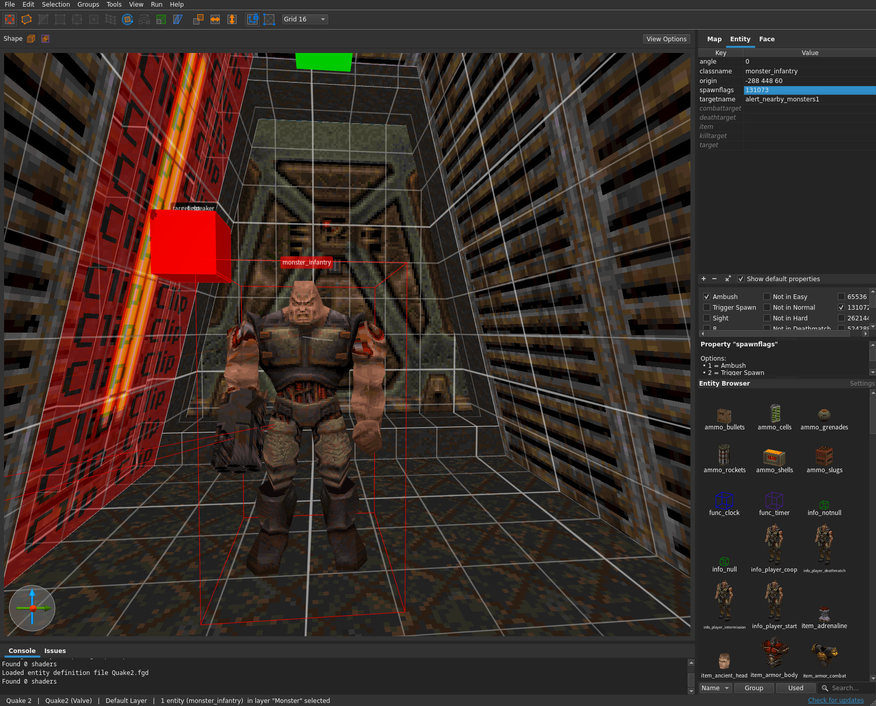 TrenchBroom 的 3D 视图显示带有物品和触发器实体标记的 Quake 地图,以及面检查器面板